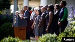 U.S. President Barack Obama delivers remarks alongside Americans the White House says will benefit from the opening of health insurance marketplaces under the Affordable Care Act, at the White House, Washington, Oct. 1, 2013. 