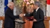 European Union foreign policy chief Josep Borrell, left, and Japanese Foreign Minister Takeshi Iwaya shake hands following a signing ceremony at the Iikura Guest House in Tokyo, Nov. 1, 2024.