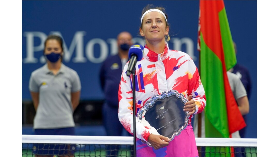 Victoria Azarenka, of Belarus, holds the runner-up trophy after losing to Naomi Osaka, of Japan, in the women's singles final of the U.S. Open tennis championships, Sept. 12, 2020, in New York.