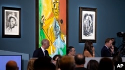 Buyers and attendees mingle during an auction of Pablo Picasso's master works at the Bellagio hotel and casino, Oct. 23, 2021, in Las Vegas.