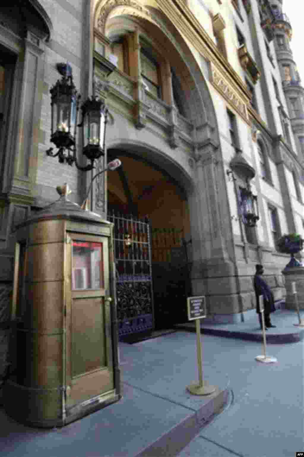 A lone doorman stands outside the Dakota on New York's Upper West Side, Wednesday, Dec. 8, 2010, where John Lennon was shot 30 years ago. (AP Photo/Richard Drew)