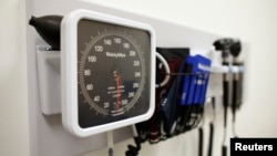 FILE - Medical equipment is pictured on the wall of an examination room in San Diego, California, Nov. 17, 2014.