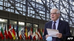 FILE - EU High Representative of the Union for Foreign Affairs and Security Policy Josep Borrell talks to the press as he arrives to attend an EU Foreign Ministers meeting in Brussels, Feb. 22, 2021. (Photo by Yves Herman/Pool/AFP)