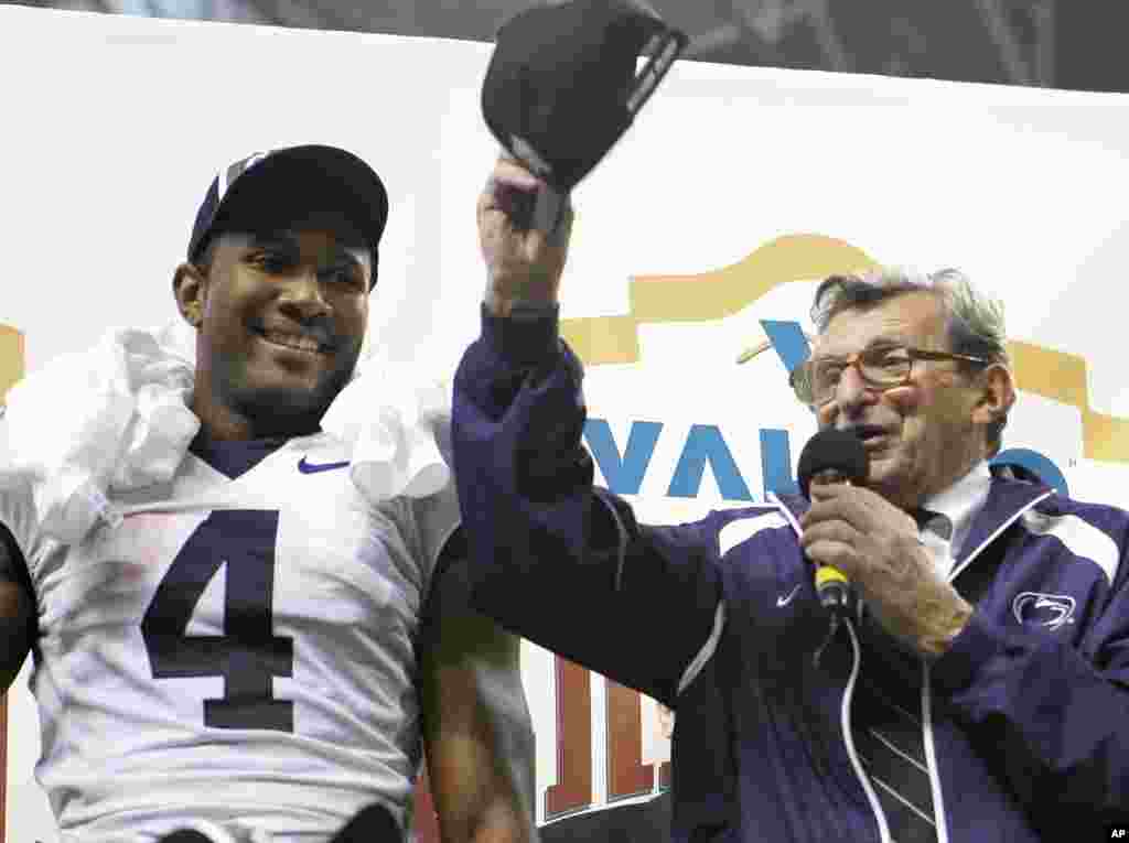 Penn State coach Joe Paterno reacts after beating Texas A&M 24-17 to win the Alamo Bowl college football game in San Antonio. At left is Penn State wide receiver Terrell Golden, December 30, 2007. (AP)