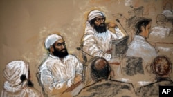 Caricature de jihadistes présumés sur la base américaine de Guantanamo, Cuba, le 16 juillet 2009. 