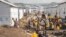 FILE —People displaced by the ongoing fighting between DRC forces and M23 rebels gather in a camp on the outskirts of Goma, Democratic Republic of Congo, March 13, 2024,