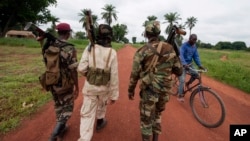 FILE - Members of a rebel group are seen in the town of Bria, Central African Republic, July 15, 2013.