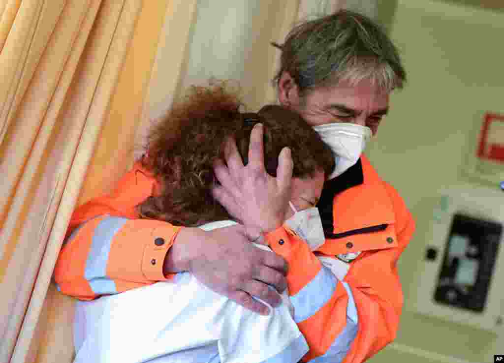 Nurse Elena Betti reacts after receiving the Pfizer-BioNTech COVID-19 vaccine at the Careggi hospital in Florence, Italy.