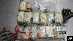 This photo released Tuesday, Aug. 11, 2015 by the Australian Federal Police shows bars of soap filled with cocaine seized from a 91-year-old retired surgeon as he returned home from India. 