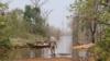 As river level rises in Stung Treng province’s Srekor commune, the Lower Sesan 2 dam begins to store water, on March 12, 2020. (Sun Narin/VOA Khmer) 