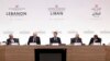 France's President Emmanuel Macron, center, flanked by Lebanese and French officials, chairs an international aid conference for Lebanon, in Paris, Oct.24, 2024.