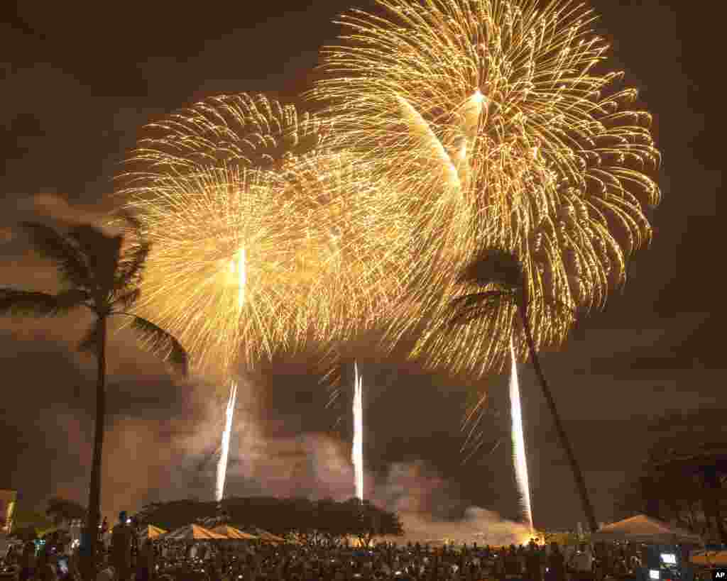 Fireworks from Nagaoka City, Japan, explode over Ford Island to celebrate the 70th anniversary of the end of World War II at Joint Base Pearl Harbor-Hickam Hawaii, in Honolulu, Aug. 15, 2015.