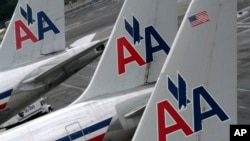 FILE - American Airlines planes at the JFK International Airport in New York.