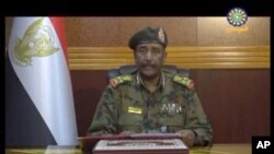 FILE - This Image from video provided by Sudan TV, shows Lieutenant General Abdel-Fattah Burhan, head of the Sudanese Transitional Military Council, TMC, making a broadcast announcement in Khartoum, June 4, 2019.