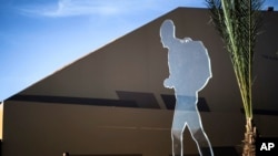 An art installation depicting a migrant is placed at the venue of the U.N. Migration Conference in Marrakech, Morocco, Dec. 11, 2018. 