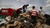 Venezuelan Scavengers Vie with Vultures for Brazilian Trash