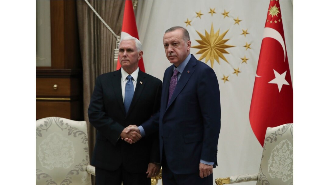U. S. Vice President Mike Pence, left, and Turkish President Recep Tayyip Erdogan pose together at the presidential palace, in Ankara, Turkey, Oct. 17, 2019.