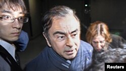 FILE - Former Nissan Motor Chairman Carlos Ghosn leaves his lawyer's office in Tokyo, Japan, April 3, 2019.