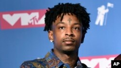 FILE - 21 Savage poses in the press room at the MTV Video Music Awards at Radio City Music Hall in New York, Aug. 20, 2018.