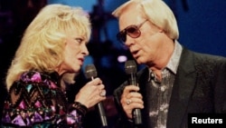 Country singer George Jones, (R) pictured with Tammy Wynette at the Country Music Association Awards in Nashville, Oct. 4, 1995.