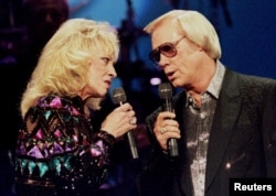 Country singer George Jones, (R) pictured with Tammy Wynette at the Country Music Association Awards in Nashville, Oct. 4, 1995.