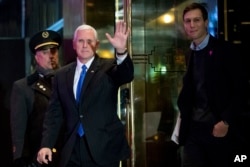 FILE - Vice President-elect Mike Pence, second from left, and Jared Kushner, son in-law of President-elect Donald Trump, right, depart Trump Tower in New York, Dec. 7, 2016.