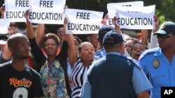 FILE - Protesting university students demand free education during a rally in Cape Town, South Africa, Oct. 22, 2015.