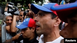 Venezuela opposition leader and Governor of Miranda state Henrique Capriles confronts security forces while rallying against President Nicolas Maduro in Caracas, Venezuela, May 12, 2017.