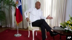 Haiti's President Michel Martelly speaks during an interview at the National Palace in Port-au-Prince, Haiti, Monday, Dec. 21, 2015.