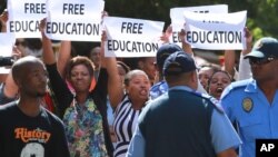 FILE - Protesting university students demand free education during a rally in Cape Town, South Africa, Oct. 22, 2015.