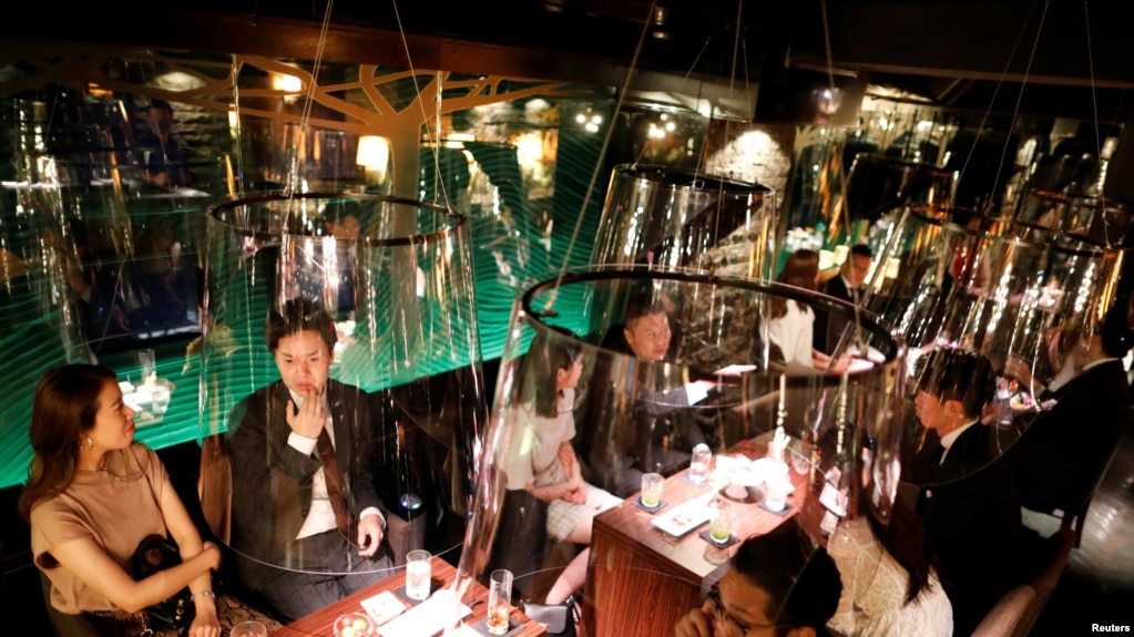 Acrylic screens used as part of measures to prevent the spread of COVID-19 are installed at the Jazz Lounge Encounter, a night club in Tokyo, Japan.