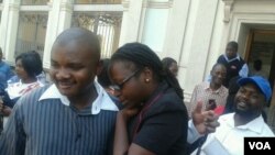 Cynthia Manjoro (right) seen outside the courtroom soon after she was acquitted with 20 others.