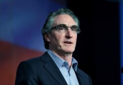 FILE - Governor Doug Burgum (R-ND) speaks to delegates at the Republican State Convention in Grand Forks, North Dakota, April 7, 2018.