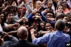 FILE - President Barack Obama meets with members of the audience as he campaigns in support of Pennsylvania candidates in Philadelphia, Sept. 21, 2018. Two months out from Election Day, Democrats are increasingly confident about their prospects to pick up