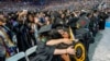 FILE - UCLA students celebrate during a commencement ceremony inside Pauley Pavilion on UCLA campus, in Los Angeles, June 14, 2024.