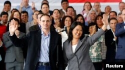 Keiko Fujimori, accompanied by her husband, Mark Villanella, and elected congressmen, waves to the media after Peru's electoral office ONPE said she lost the country's presidential election, in Lima, June 10, 2016.
