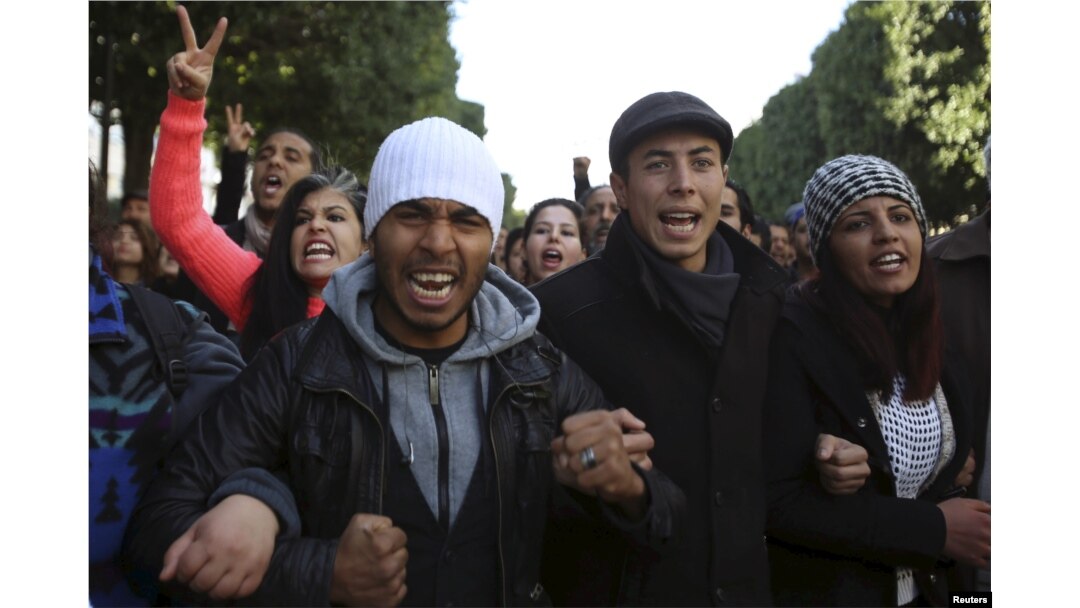 Unemployed graduates shout slogans during a demonstration to demand the government provide them with job opportunities, on Habib Bourguiba Avenue in Tunis, Tunisia, Jan. 20, 2016.