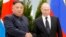 Владимир Путин и Ким Чен Ын пожимают друг другу руки во время встречи во Владивостоке, Россия, 25 апреля 2019