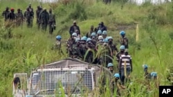 FILE: United Nations peacekeepers recover bodies from an area near the site where a U.N. convoy was attacked in Nyiragongo, North Kivu province, Congo, on Monday, Feb. 22, 2021. Luca Attanasio, Italian ambassador to the Congo, was one of three murder victims.