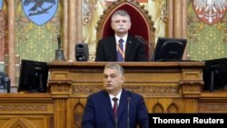 File - Hungarian Prime Minister Orban addresses Parliament in Budapest, Feb 15, 2021.