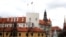 Latvian flag and presidential standard flutter over the Riga Castle, in Riga, Latvia, April 9, 2019.
