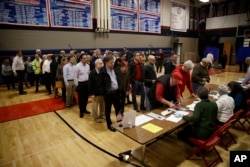 Voters line up to vote at a polling place in Doylestown, Pa., Nov. 6, 2018.