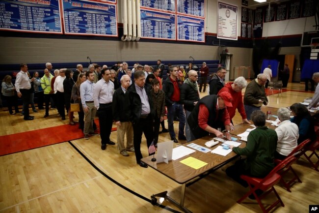 Voters line up to vote at a polling place in Doylestown, Pa., Nov. 6, 2018.