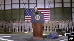 President Barack Obama speaks to the troops at a rally during an unannounced visit at Bagram Air Field in Afghanistan, 03 Dec 2010