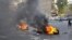 A handout picture released by the Syrian opposition's Shaam News Network on July 17, 2012 shows opponents to the regime blocking the roads with burning tires in Damascus Jobar neigborhood on July 16. (AFP photo/HO/Shaam News Network)