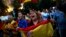 Anti-independence demonstrators waving Spanish flags shout slogans during a protest in Barcelona, Oct. 4, 2017.