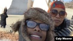 Sydni Barra (front) and her mother Wendi Cherry helped beautify Martin Luther King Memorial Park in Washington, D.C. (Photo by W. Cherry)