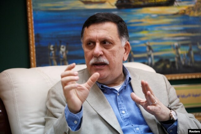 FILE PHOTO: Prime Minister of Libya's unity government Fayez Seraj speaks during an interview with Reuters at his office in the naval base of Tripoli, Libya, June 3, 2016.