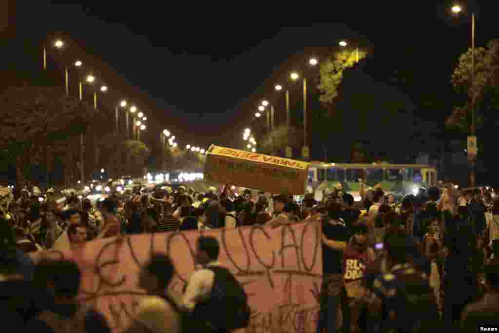 Students, and members of the "Free Pass" movement, take part in a protest demanding improvements be made to the public transport system, at the bus station in the center of Brasilia, Brazil, June 19, 2013.