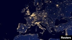 FILE - A nighttime view of Europe and North Africa is seen in a global composite assembled from data acquired by the Suomi National Polar-orbiting Partnership satellite in 2012.